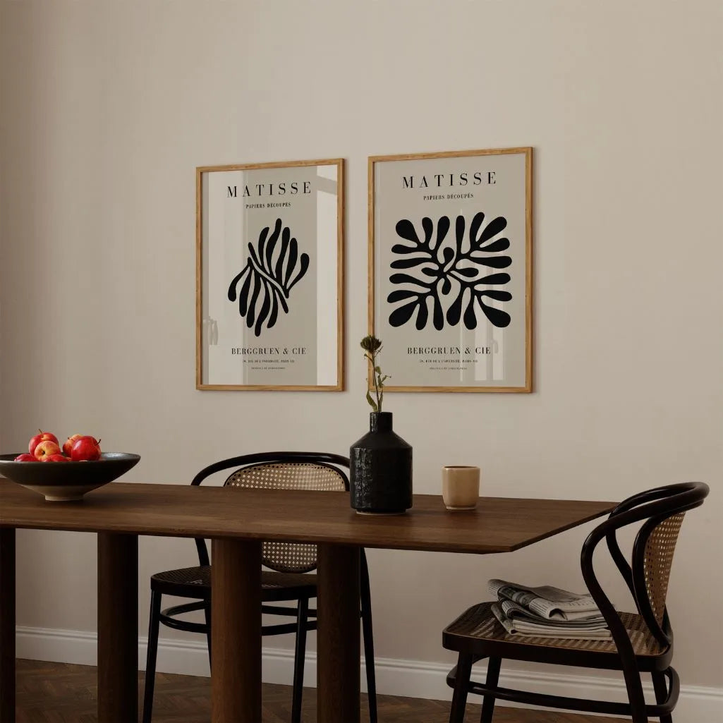 Close up of beige abstract poster set showing organic black shapes and soft tones