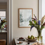 Winter forest path poster displayed in gallery wall with modern decor